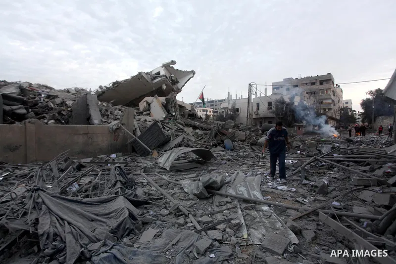 Palestinians inspect the destroyed office building of Hamas Prime Minister Ismail Haniyeh in Gaza City November 17, 2012. Israeli aircraft pounded Hamas government buildings in Gaza on Saturday, including the building ho...