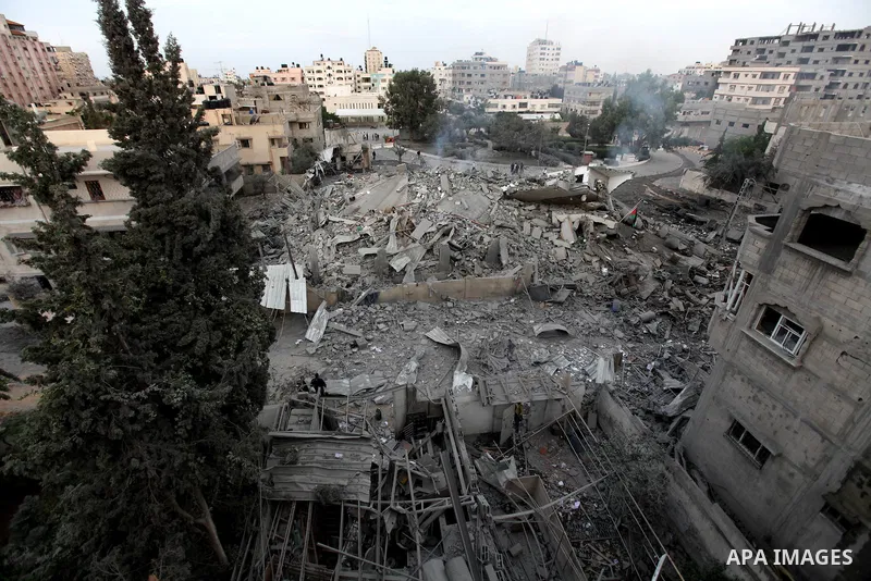 Palestinians inspect the damage at Prime Minister in Gaza Ismail Haniyeh's office after being destroyed during an overnight Israeli airstrike in Gaza City, Saturday, Nov. 17, 2012. Israel bombarded the Hamas-ruled Gaza S...