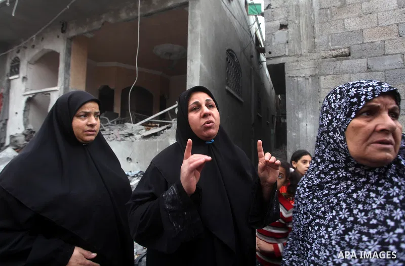 Palestinians inspect the rubble of a destroyed house after an Israeli airstrike in the Jebaliya refugee camp, northern Gaza Strip, Saturday, Nov. 17, 2012. Israel bombarded the Hamas-ruled Gaza Strip with more than 180 a...