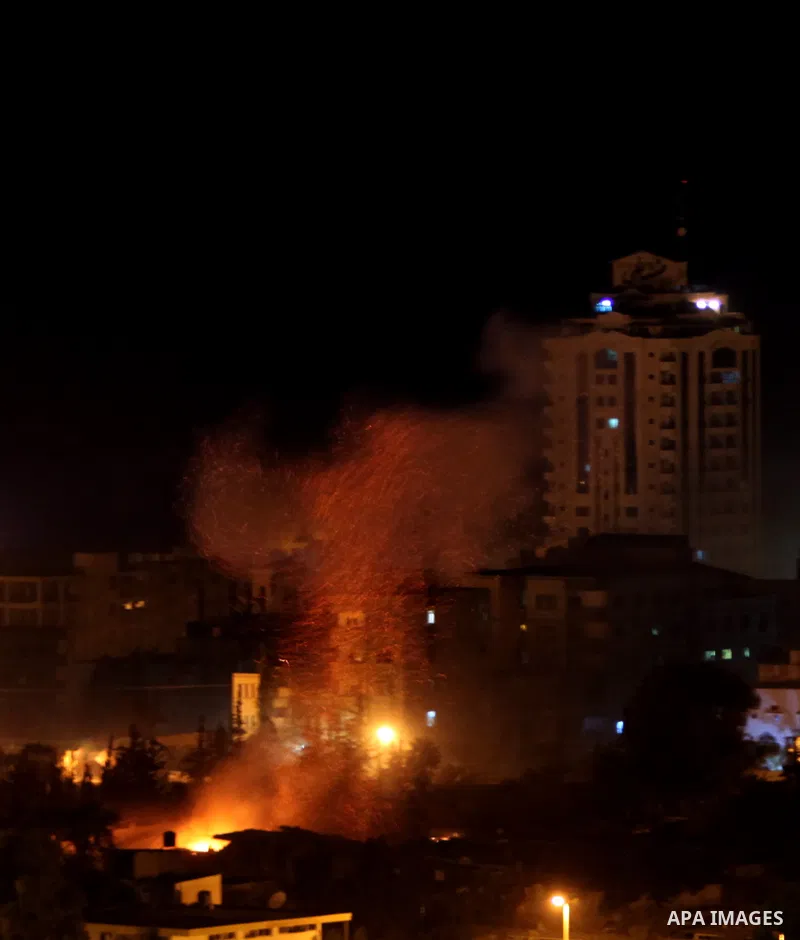 Smoke rises after Israeli air strike at Arafat city police in Gaza City on November 17, 2012. Israeli aircraft pounded Hamas government buildings in Gaza on Saturday, including the building housing the prime minister's o...
