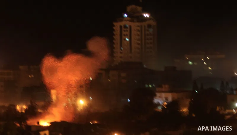Smoke rises after Israeli air strike at Arafat city police in Gaza City on November 17, 2012. Israeli aircraft pounded Hamas government buildings in Gaza on Saturday, including the building housing the prime minister's o...