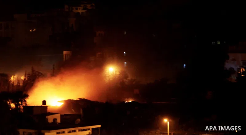 Smoke rises after Israeli air strike at Arafat city police in Gaza City on November 17, 2012. Israeli aircraft pounded Hamas government buildings in Gaza on Saturday, including the building housing the prime minister's o...