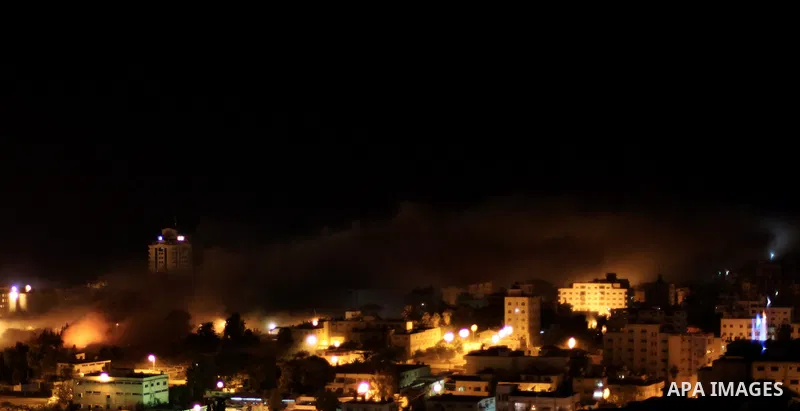 Smoke rises after Israeli air strike at Arafat city police in Gaza City on November 17, 2012. Israeli aircraft pounded Hamas government buildings in Gaza on Saturday, including the building housing the prime minister's o...