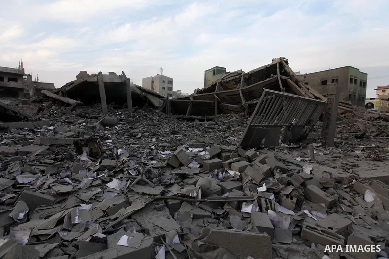 Palestinians inspect the damage in Interior Ministry building after Israeli air strikes in Gaza City, on November 17, 2012. Israeli aircraft pounded Hamas government buildings in Gaza on Saturday, including the building...