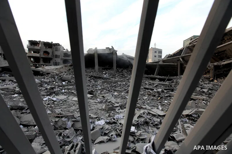 Palestinians inspect the damage in Interior Ministry building after Israeli air strikes in Gaza City, on November 17, 2012. Israeli aircraft pounded Hamas government buildings in Gaza on Saturday, including the building...
