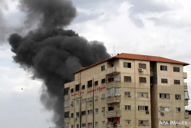 Smoke rises after Israeli air strike in Gaza City on November 17, 2012. Israeli aircraft pounded Hamas government buildings in Gaza on Saturday, including the building housing the prime minister's office, after Israel's...