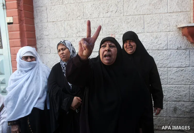 Relatives of the bodies of a Hamas militant, who was killed in an Israeli air strike, during his funeral at a mosque in the central Gaza Strip November 17, 2012. Israeli aircraft bombed Hamas government buildings in Gaza...