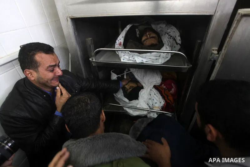 The bodies of Hamas militants are seen at the morgue of Al-Aqsa hospital in Deir al-Balah, central Gaza Strip, Saturday, Nov. 17, 2012. According to local villagers, the militants were killed during an early morning Isra...