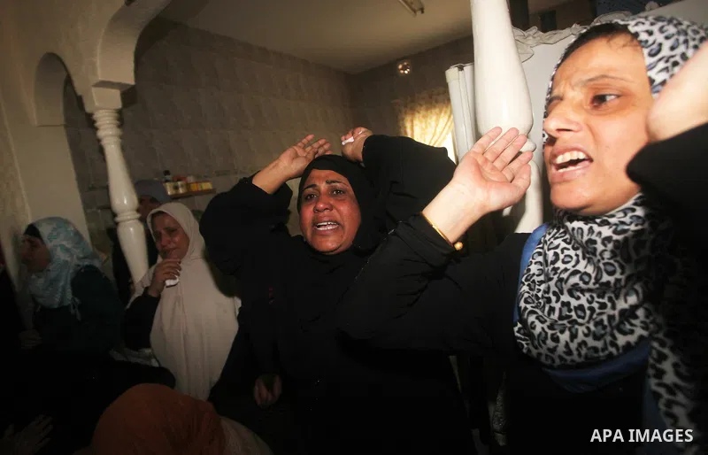 Relatives of the bodies of a Hamas militant, who was killed in an Israeli air strike, during his funeral at a mosque in the central Gaza Strip November 17, 2012. Israeli aircraft bombed Hamas government buildings in Gaza...