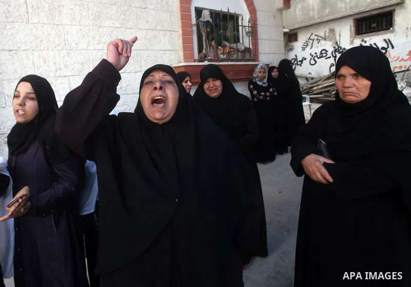 Relatives of the bodies of a Hamas militant, who was killed in an Israeli air strike, during his funeral at a mosque in the central Gaza Strip November 17, 2012. Israeli aircraft bombed Hamas government buildings in Gaza...