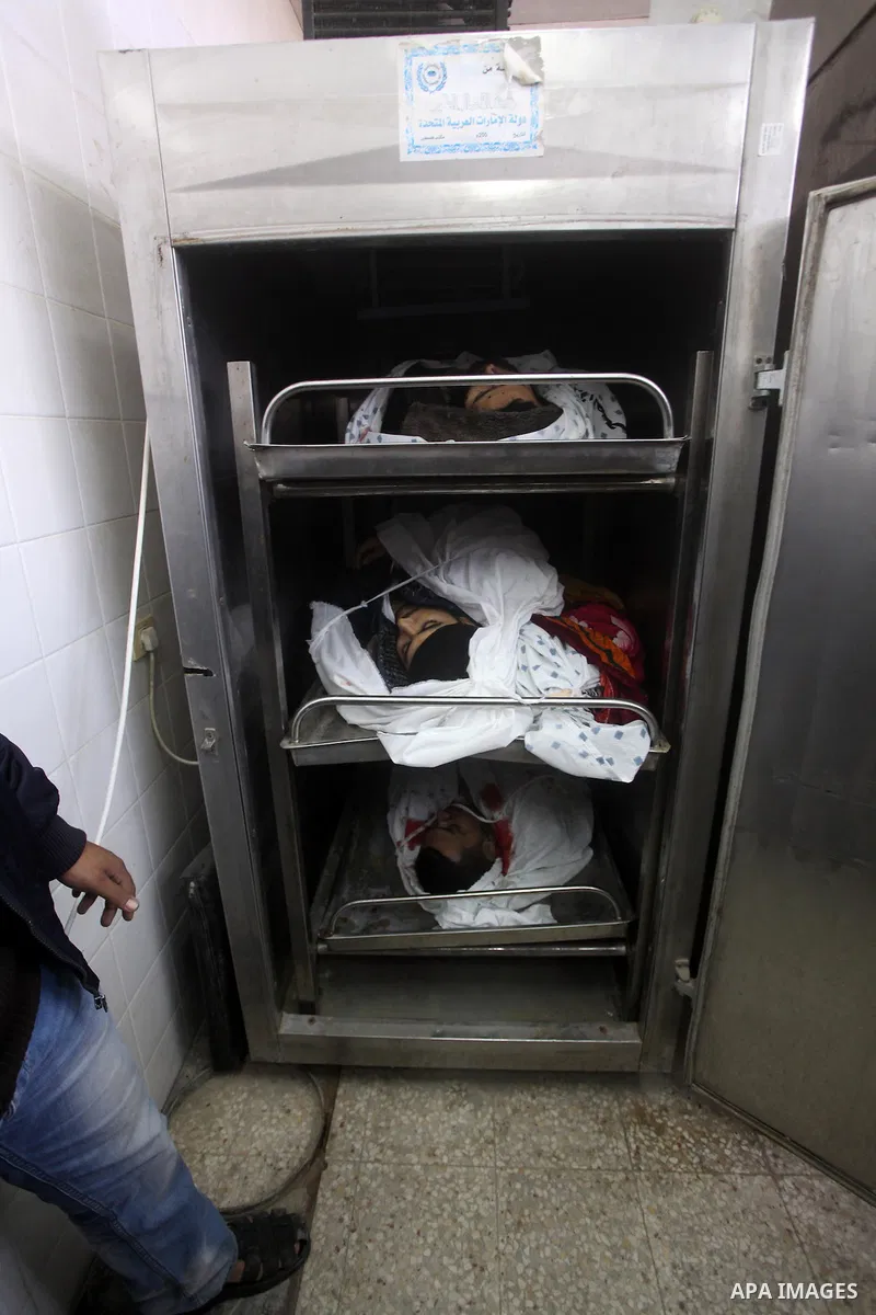 The bodies of Hamas militants are seen at the morgue of Al-Aqsa hospital in Deir al-Balah, central Gaza Strip, Saturday, Nov. 17, 2012. According to local villagers, the militants were killed during an early morning Isra...