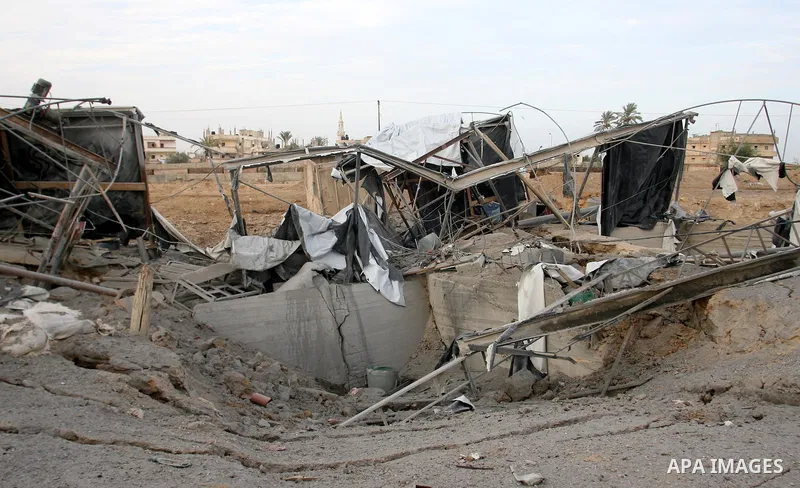 Palestinians inspect the damage at the smuggling tunnels area in the border between Gaza strip and Egypt after Israeli airstrikes in Rafah in the southern Gaza Strip November 16, 2012. Israel bombarded the Hamas-ruled Ga...