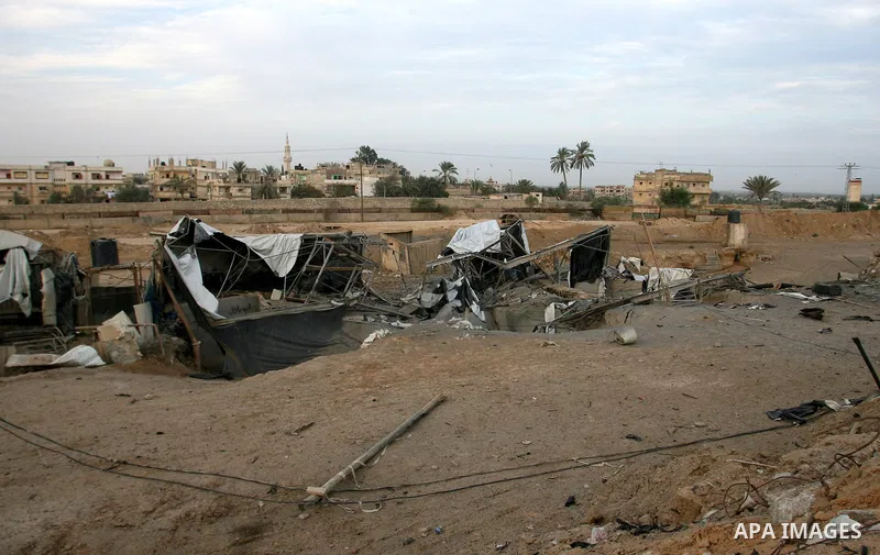Palestinians inspect the damage at the smuggling tunnels area in the border between Gaza strip and Egypt after Israeli airstrikes in Rafah in the southern Gaza Strip November 16, 2012. Israel bombarded the Hamas-ruled Ga...