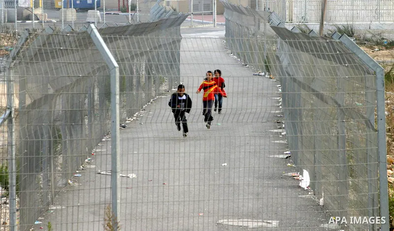 Palestinian students pass through the Shuafat military checkpoint in the east Jerusalem on November 17, 2012. Palestinian militants nearly hit Jerusalem with a rocket for the first time in decades on Friday and fired at...