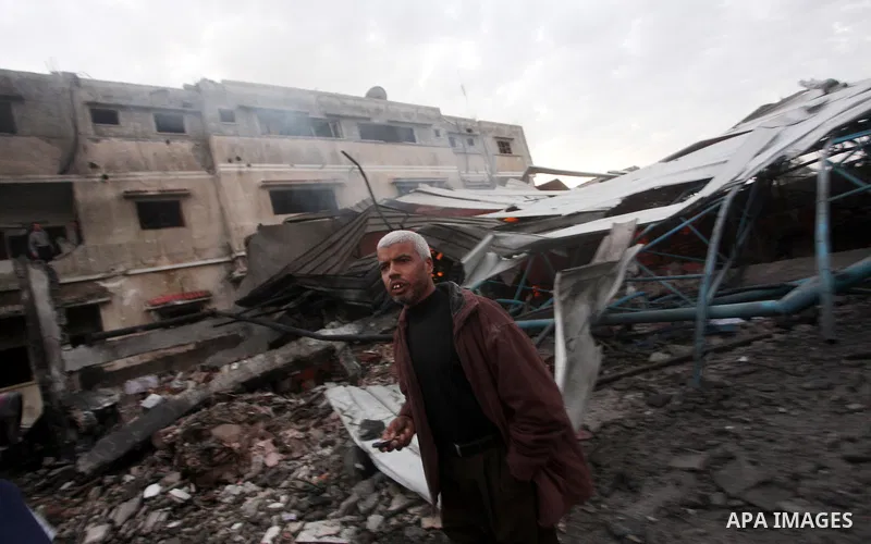 Palestinians inspect the damage in a Palestinian house after an Israeli strike in Zeitun, outskirts of Gaza City, Saturday, Nov. 17, 2012. Israeli aircraft bombed Hamas government buildings in Gaza on Saturday, including...