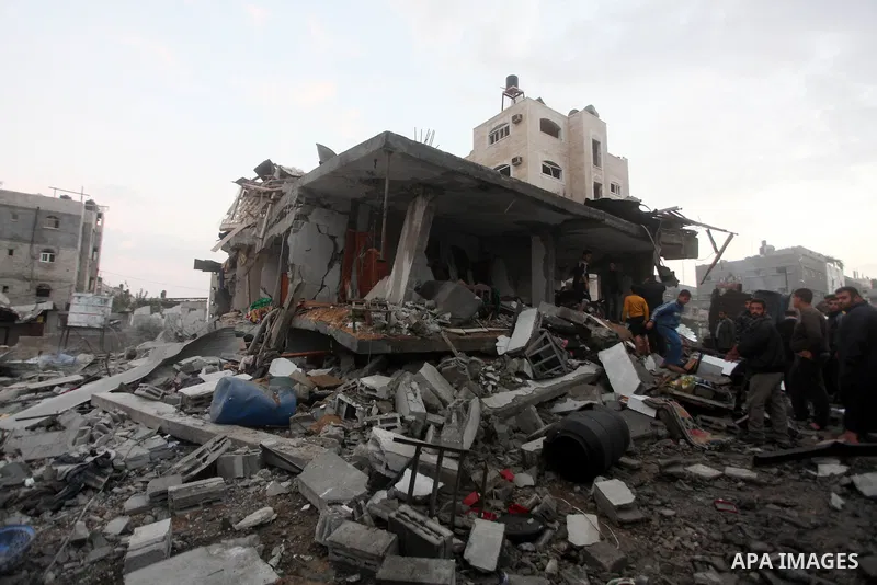 Palestinians inspect the damage in a Palestinian house after an Israeli strike in Zeitun, outskirts of Gaza City, Saturday, Nov. 17, 2012. Israeli aircraft bombed Hamas government buildings in Gaza on Saturday, including...