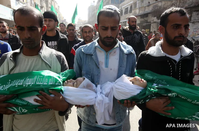 Palestinians carry the bodies of two children during their funeral in the northern Gaza Strip November 18, 2012. Two children Jumana Abu Seifan, 18 months old, and her brother Tamer, three and a half years old, were kill...