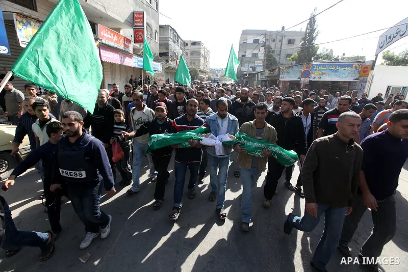 Palestinians carry the bodies of two children during their funeral in the northern Gaza Strip November 18, 2012. Two children Jumana Abu Seifan, 18 months old, and her brother Tamer, three and a half years old, were kill...