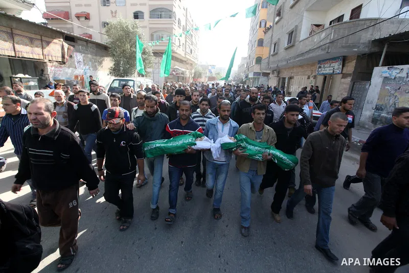 Palestinians carry the bodies of two children during their funeral in the northern Gaza Strip November 18, 2012. Two children Jumana Abu Seifan, 18 months old, and her brother Tamer, three and a half years old, were kill...
