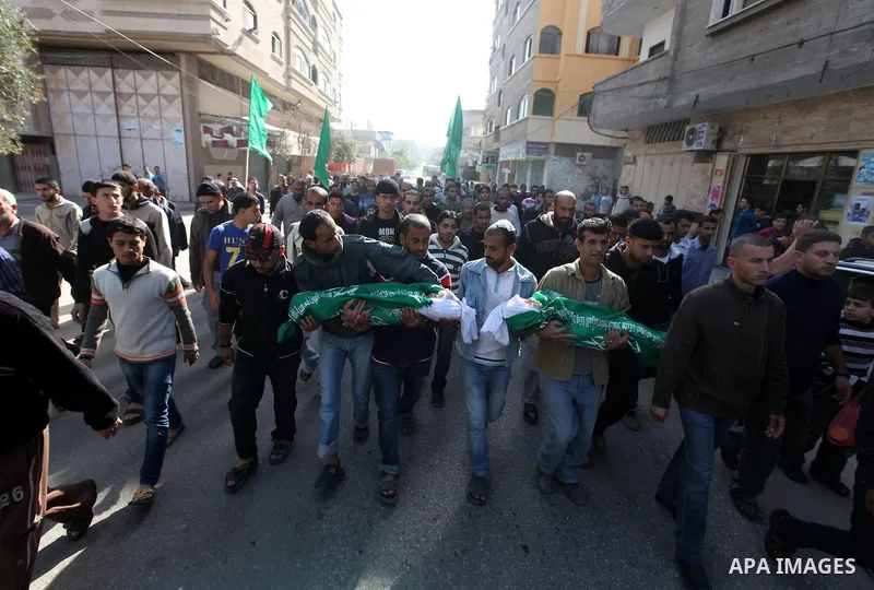 Palestinians carry the bodies of two children during their funeral in the northern Gaza Strip November 18, 2012. Two children Jumana Abu Seifan, 18 months old, and her brother Tamer, three and a half years old, were kill...