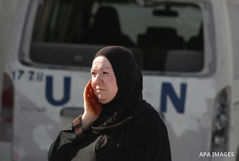 A Palestinian woman looks at the damage at a UN Supply Center after being damaged by an Israeli airstrike directed at a Hamas police headquarters nearby in Jabalya refugee camp northern of Gaza Strip on November 18, 2012...