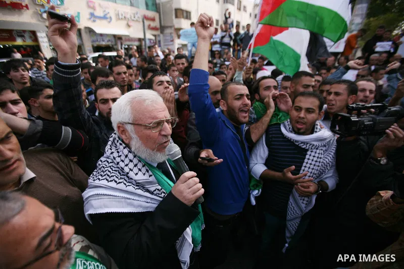 Aziz Dweik speaker of the Palestinian Legislative Council and a representative of the Hamas movement joins hundreds of students from Hebron University as they demonstrate against the Israeli military attacks on the Pales...