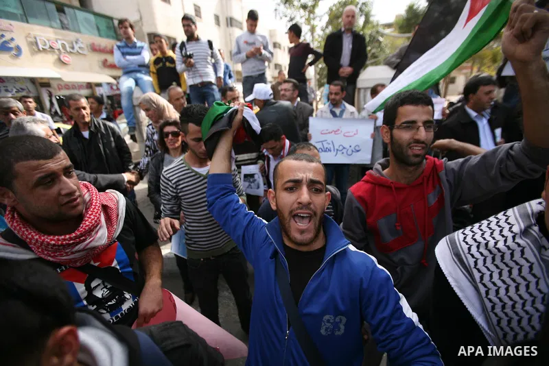 Hundreds of students from Hebron University some shouting and holding up the Palestinian flag demonstrate against the Israeli military attacks on the palestinian Gaza strip, in the West Bank town of Hebron, on November 1...
