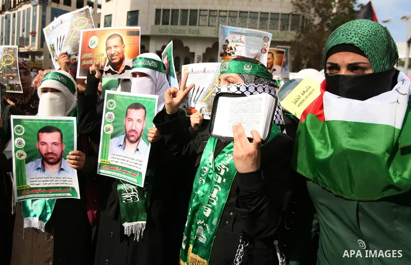 Hundreds of students from Hebron University some shouting and holding up the Palestinian flag demonstrate against the Israeli military attacks on the palestinian Gaza strip, in the West Bank town of Hebron, on November 1...