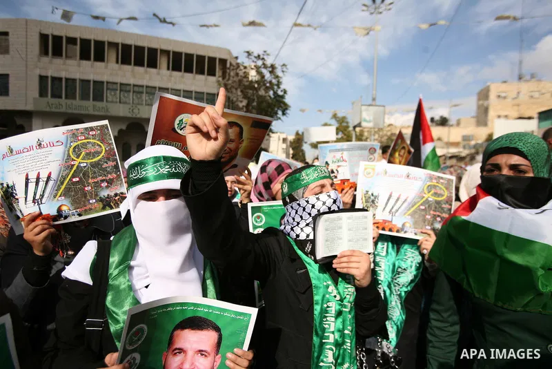 Hundreds of students from Hebron University some shouting and holding up the Palestinian flag demonstrate against the Israeli military attacks on the palestinian Gaza strip, in the West Bank town of Hebron, on November 1...