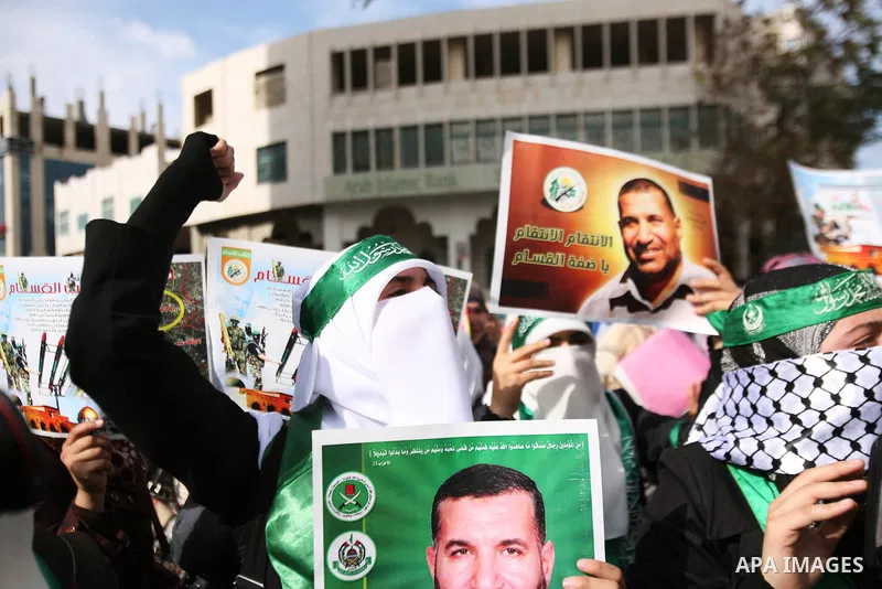 Hundreds of students from Hebron University some shouting and holding up the Palestinian flag demonstrate against the Israeli military attacks on the palestinian Gaza strip, in the West Bank town of Hebron, on November 1...