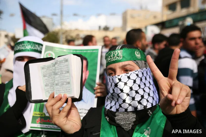 Hundreds of students from Hebron University some shouting and holding up the Palestinian flag demonstrate against the Israeli military attacks on the palestinian Gaza strip, in the West Bank town of Hebron, on November 1...