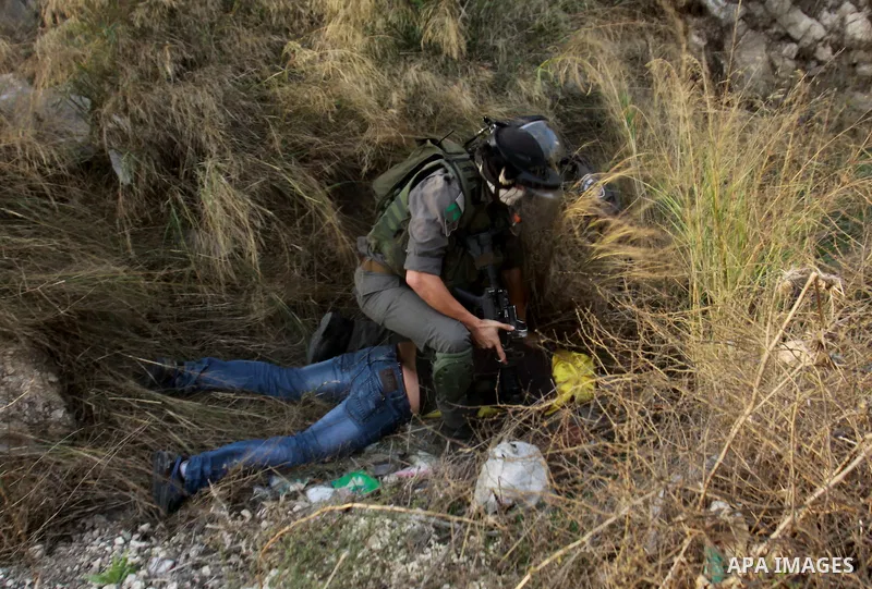 Israeli soldiers arrest a Palestinian protester during clashes following a protest against Israel's operations in the Gaza Strip, at Howwara checkpoint near Nablus, the West Bank, 18 November 2012. Reports state that the...
