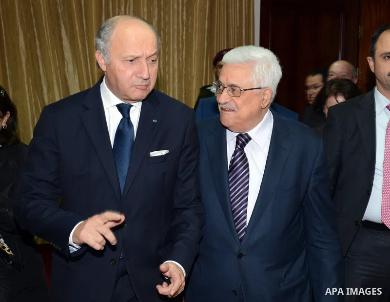 Palestinian President Mahmoud Abbas meets with French Foreign Minister, in the West Bank city of Ramallah, November 18, 2012. Photo by Thaer Ganaim