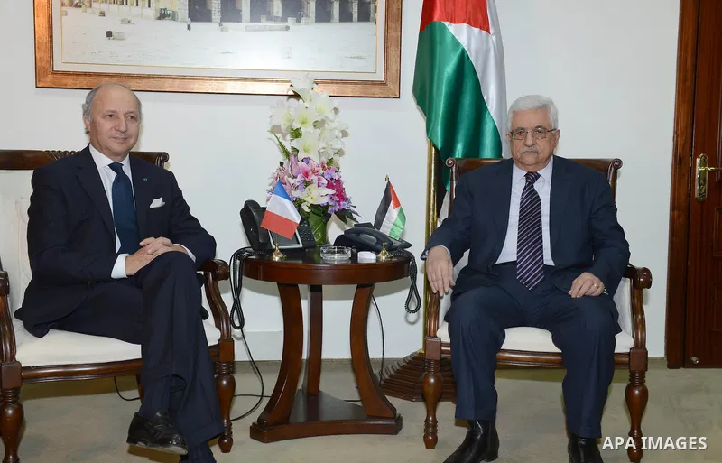 Palestinian President Mahmoud Abbas meets with French Foreign Minister, in the West Bank city of Ramallah, November 18, 2012. Photo by Thaer Ganaim