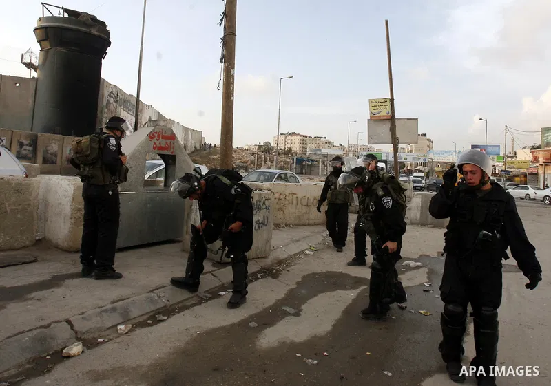 Israeli border policemen shoots a tear gas canister at Palestinian protesters during a Palestinian protest at Damascus Gate in East Jerusalem, 18 November 2012, showing solidarity with the Palestinians in the Gaza Strip,...