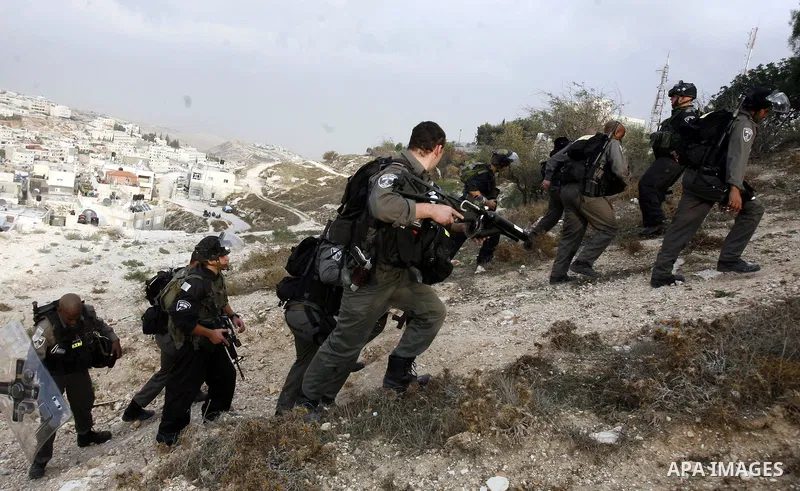 Israeli border policemen shoots a tear gas canister at Palestinian protesters during a Palestinian protest at Damascus Gate in East Jerusalem, 18 November 2012, showing solidarity with the Palestinians in the Gaza Strip,...