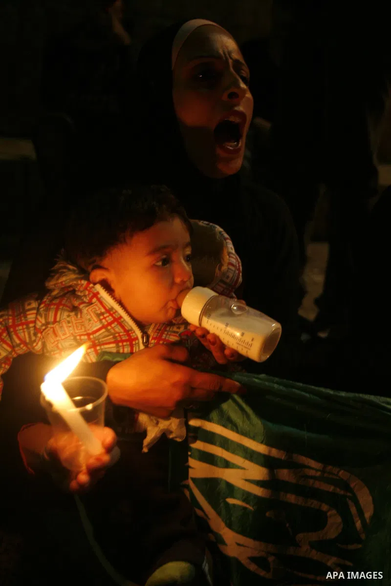 A Palestinian Woman holding a small placard reading in Arabic, 'Gaza Haram,' or 'Gaza forbidden (off limits)' during a Palestinian protest at Damascus Gate in East Jerusalem, 18 November 2012, showing solidarity with the...