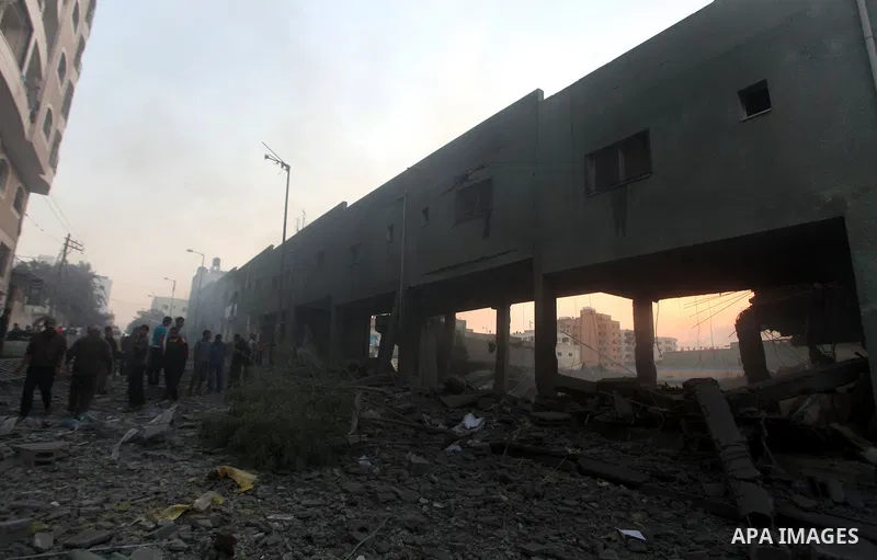 Palestinians search the debris of a destroyed home following an Israeli air strike in Gaza City, on November 19, 2012. Israeli air strikes on Sunday killed 31 Palestinians in the bloodiest day so far of its air campaign...