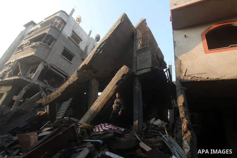 Palestinians search the debris of a destroyed home following an Israeli air strike in Gaza City, on November 19, 2012. Israeli air strikes on Sunday killed 31 Palestinians in the bloodiest day so far of its air campaign...