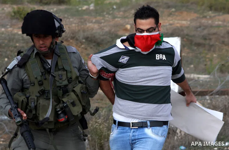 Israeli soldiers arrest a Palestinian protester during clashes following a protest against Israel's operations in the Gaza Strip, at Howwara checkpoint near Nablus, the West Bank, 17 November 2012. Reports state that the...