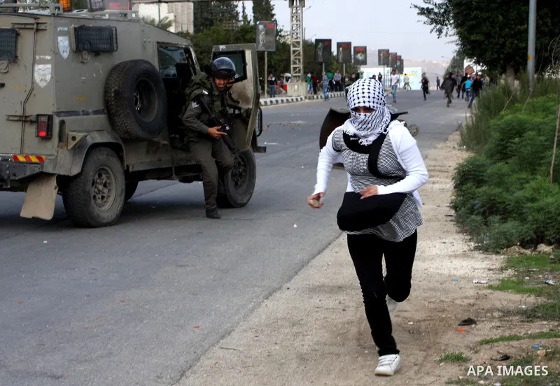 Israeli soldiers arrest a Palestinian protester during clashes following a protest against Israel's operations in the Gaza Strip, at Howwara checkpoint near Nablus, the West Bank, 17 November 2012. Reports state that the...