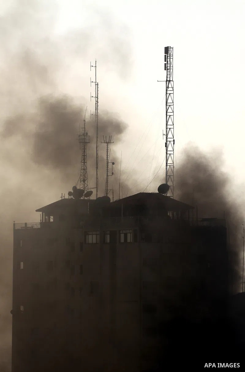 Smoke rises from al-Shorooq building which targeted by Israeli airstrike in Gaza city, 19 November, 2012. Media reports that Israeli forces were on Monday targeting the Palestinian homes and other buildings in its bombar...