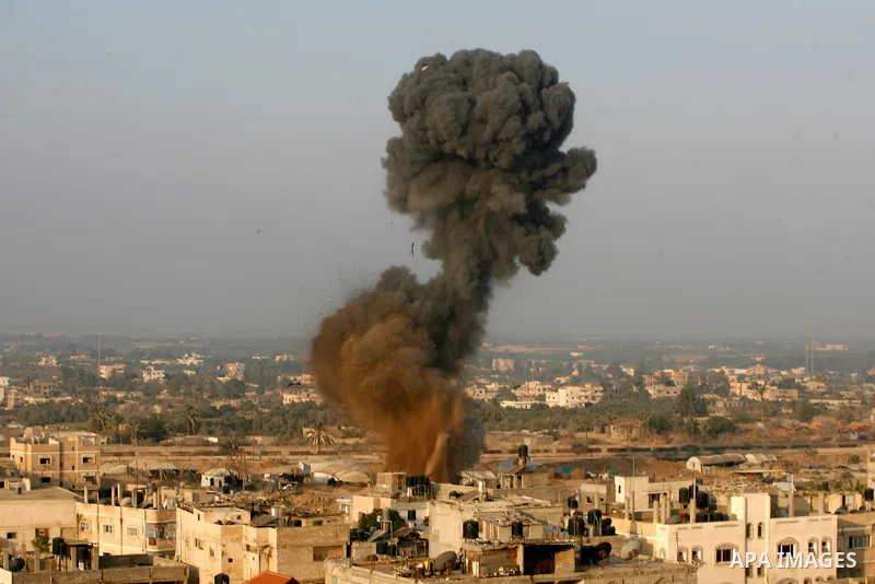 Smoke rises after an Israeli airstrike in Rafah in southern Gaza strip, 19 November, 2012. Media reports that Israeli forces were on Monday targeting the Palestinian homes and other buildings in its bombardment of the Ga...