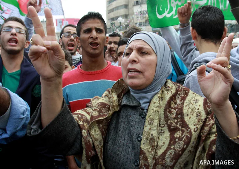 Palestinians shout slogans during a protest against Israeli military operation in the Gaza Strip, in the West Bank city of Nablus, November 19, 2012. Photo by Nedal Eshtayah