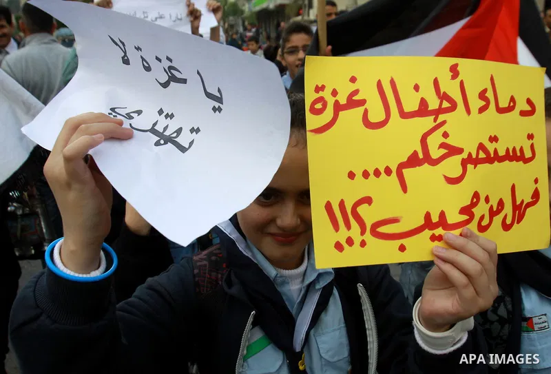 Palestinian children shout slogans during a protest against Israeli military operation in the Gaza Strip, in the West Bank city of Nablus, November 19, 2012. Photo by Nedal Eshtayah