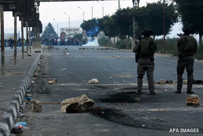 Palestinian protesters throw stones at Israeli soldiers during clashes against Israel's military operation in the Gaza Strip, in the West Bank city of Nablus on November 19, 2012. Israeli air strikes killed 22 Palestinia...