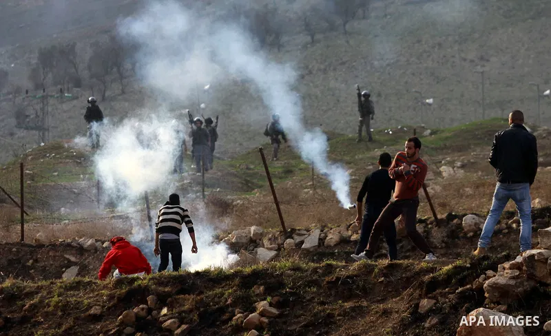 Palestinian protesters throw stones at Israeli soldiers during clashes against Israel's military operation in the Gaza Strip, in the West Bank city of Nablus on November 19, 2012. Israeli air strikes killed 22 Palestinia...