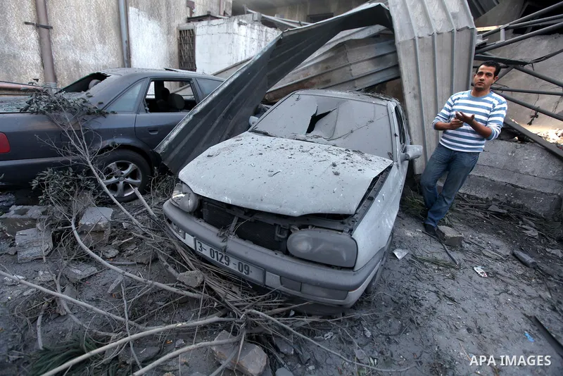 Palestinians inspect the damage after an Israeli air strike on the Islamic National Bank building in Gaza City on November 20, 2012. Israeli leaders discussed an Egyptian plan for a truce with Gaza's ruling Hamas, report...