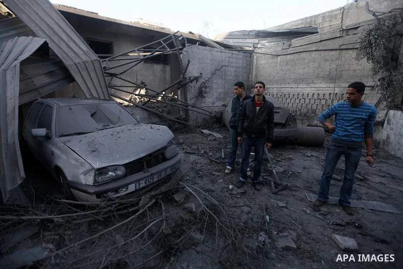 Palestinians inspect the damage after an Israeli air strike on the Islamic National Bank building in Gaza City on November 20, 2012. Israeli leaders discussed an Egyptian plan for a truce with Gaza's ruling Hamas, report...