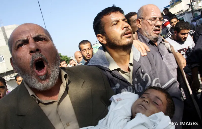 Palestinians carry the bodies of brothers Suhaib, 2-years-old, and Mohammed Hejazi, 4-years-old, during their funeral in the northern Gaza Strip area of Biet Lahia, on November 20, 2012. Four members of the Hejazi family...